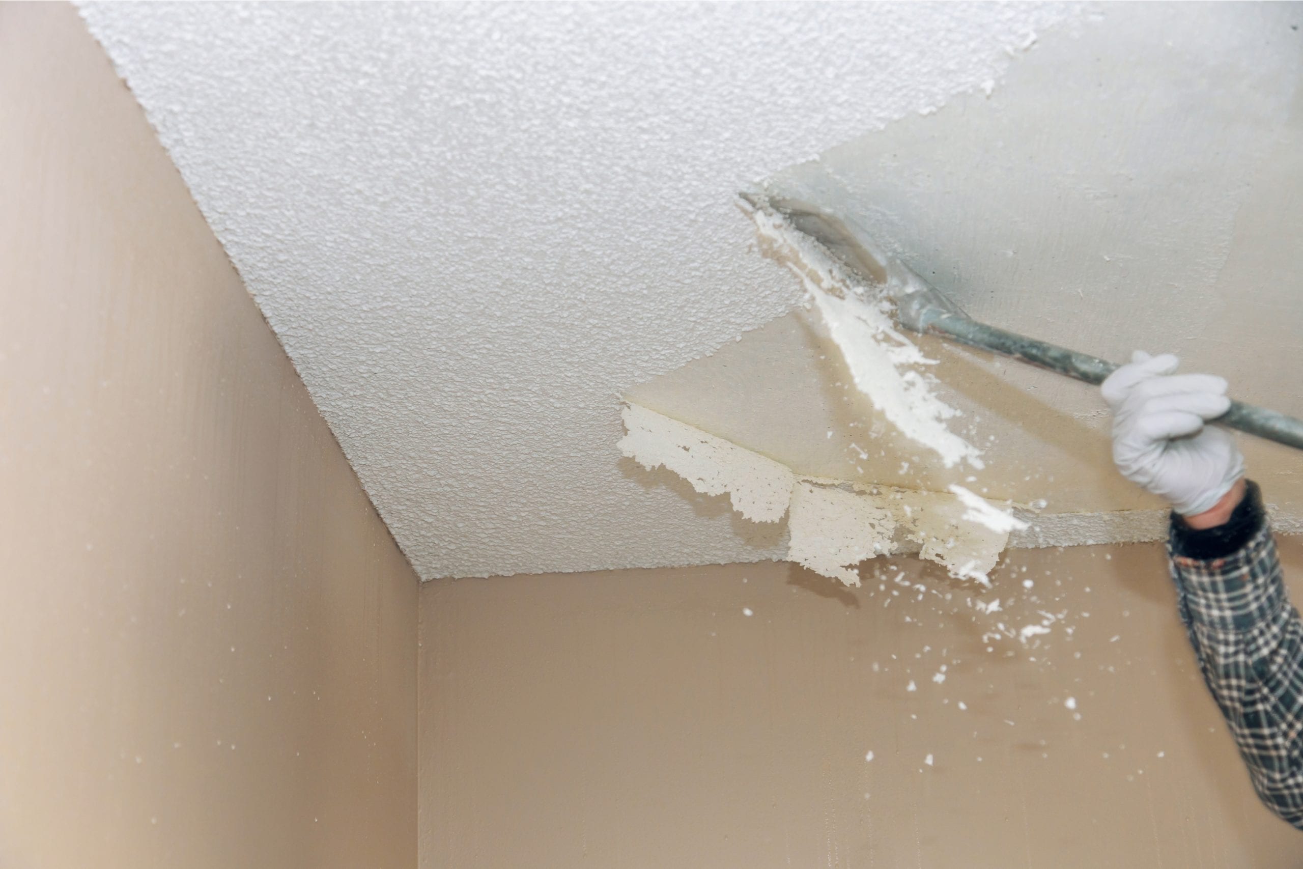 Scraping popcorn ceiling-DIY home repair hacks
