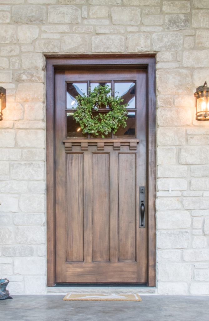 Adding a wreath makes your front door look so much more welcoming! If your front door needs a little love, here 's how to renovate a front door.