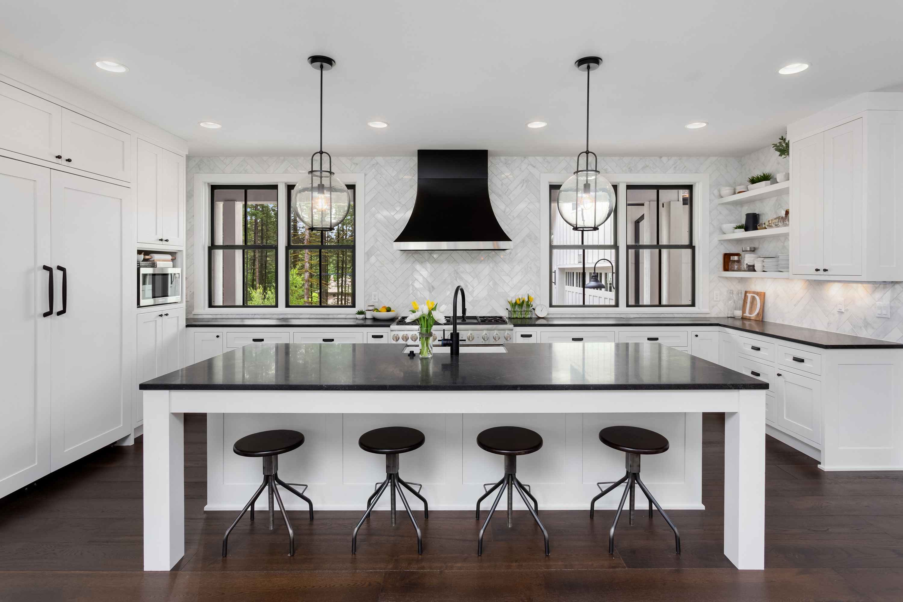 Black granite countertops and white cabinets